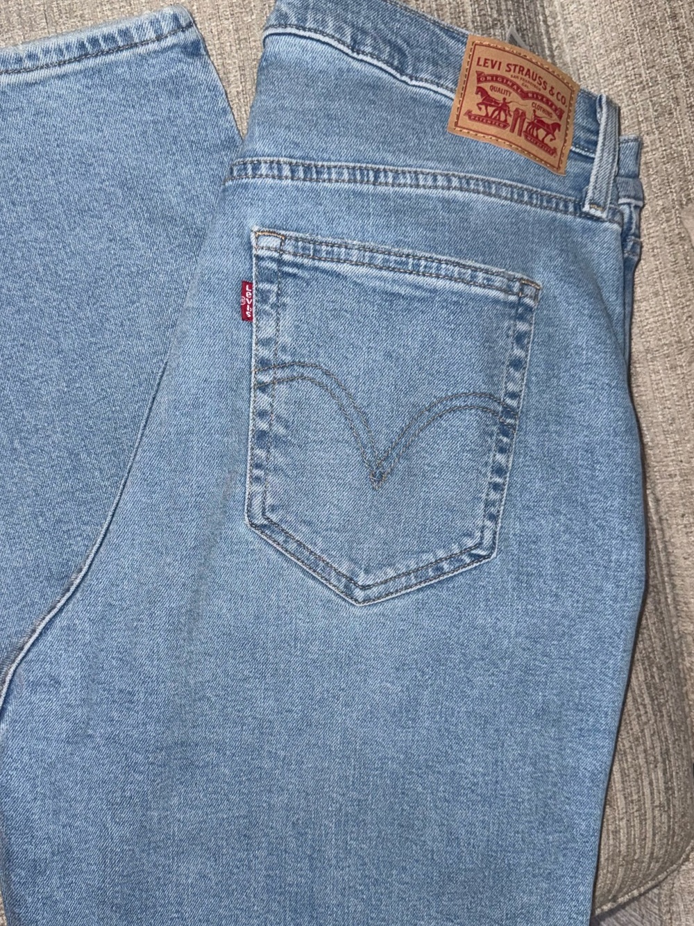 Levi's High Rise Light Blue Women's Mom Jeans with a slight tapered leg.